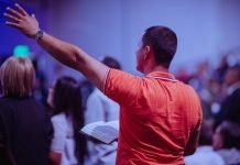 Fostering Unity in the Face of Diversity, Global Organizations Unite to Combat Religiously Motivated Violence Man Raising His Left Hand